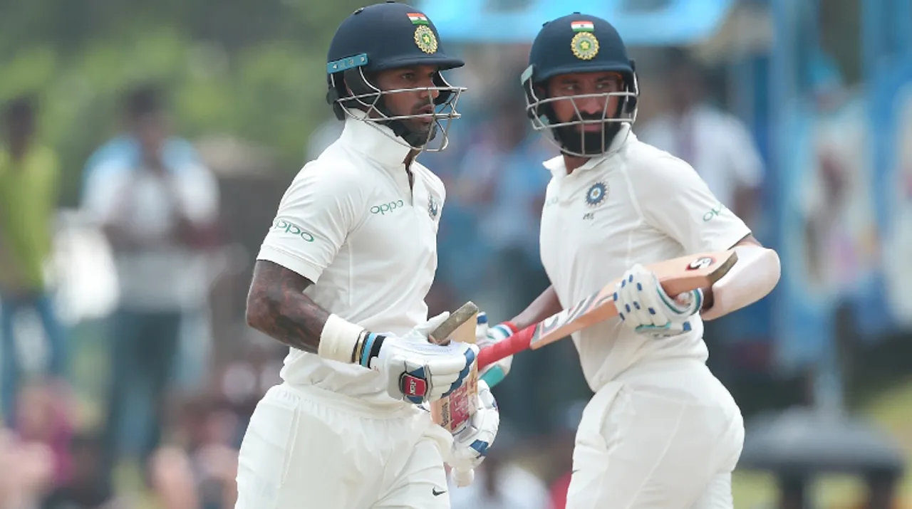  Pujara, Dhawan put India on top in Galle Test Photograph:(AFP) 