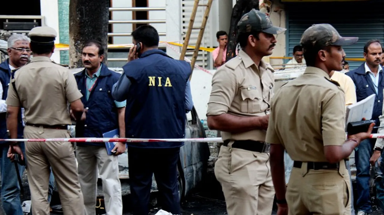  In photo: Indian National Investigative Agency officers on April 17, 2013. Photograph:(AFP) 
