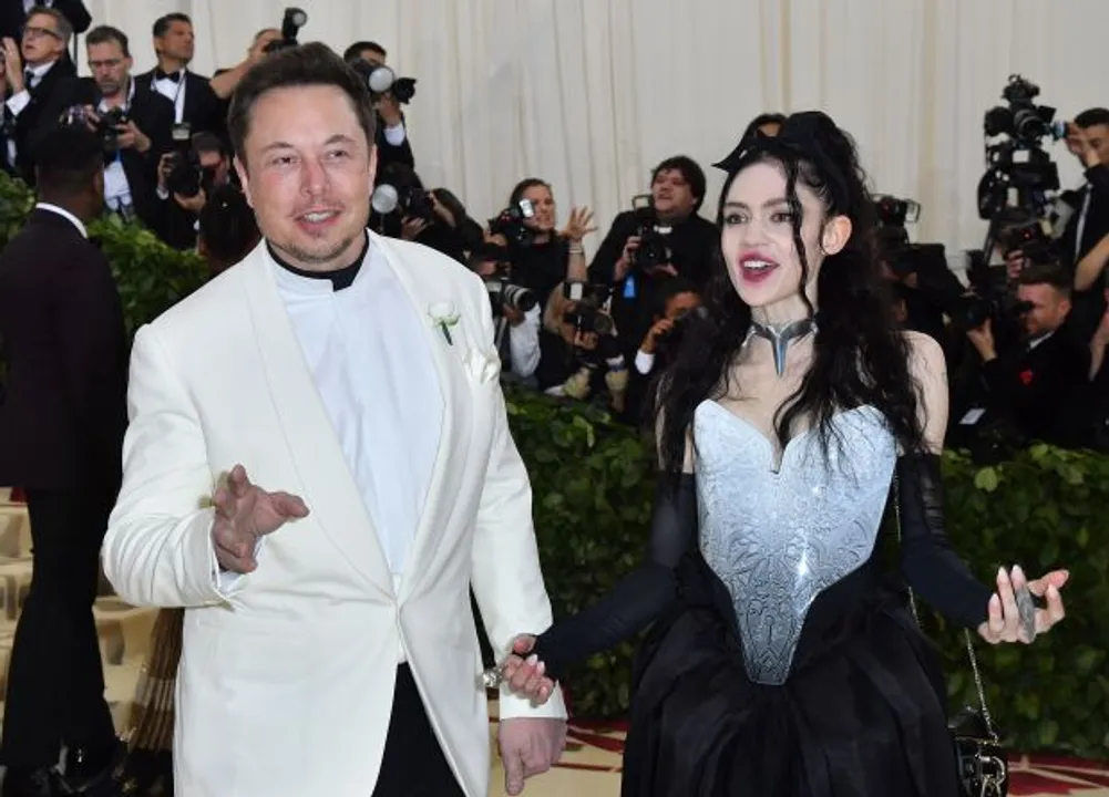  File image of Elon Musk and Grimes arriving for the 2018 Met Gala Photograph:(AFP) 