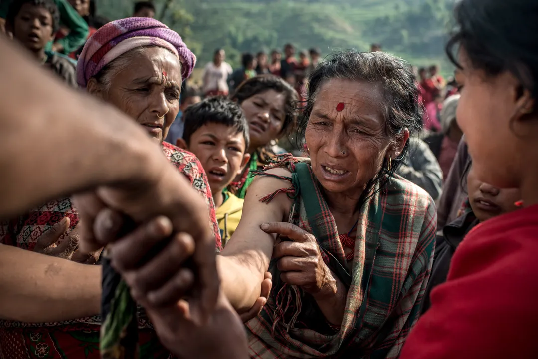  An elderly woman, who fractured an arm in Nepal's second major earthquake of May 2015, receives treatment in Lapilang. Doctors from all over the world traveled to Nepal to help survivors. Photograph:(Getty) 