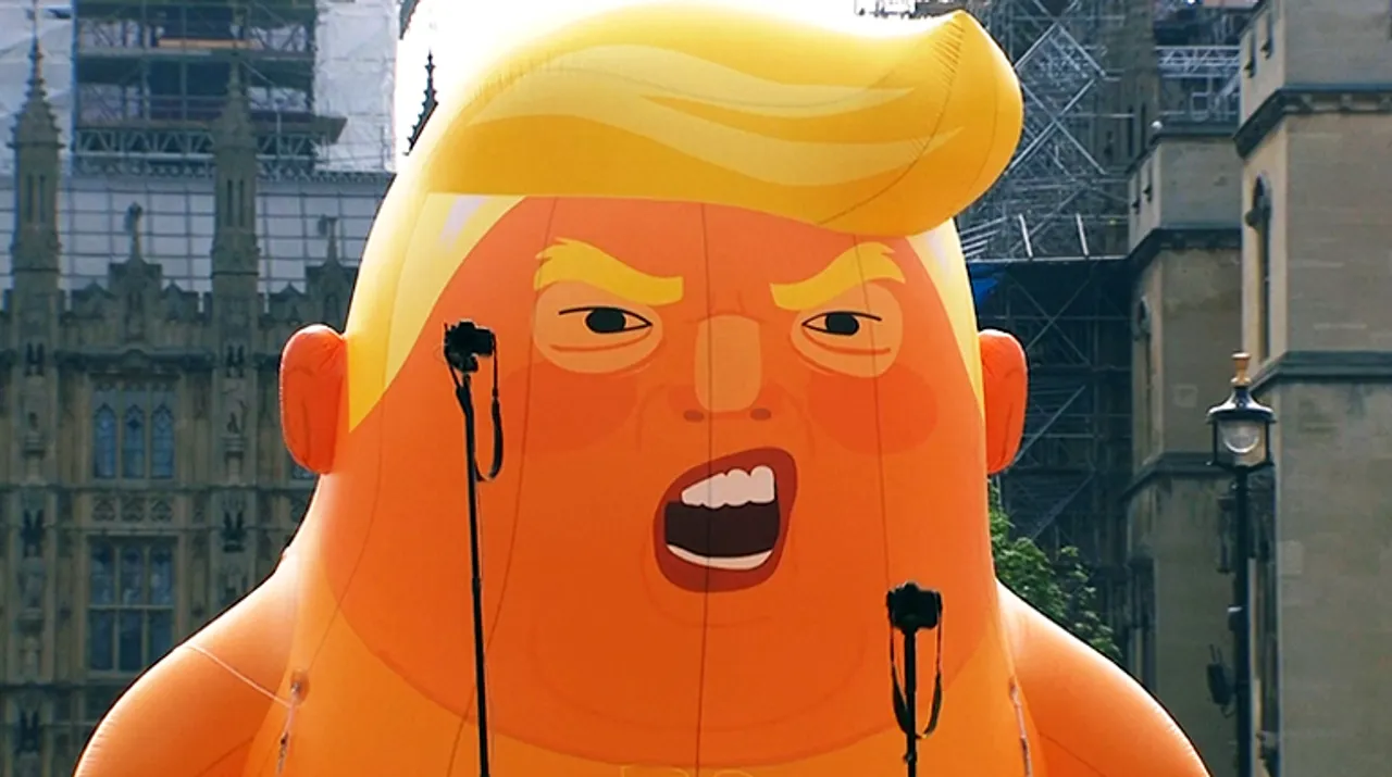  Trump opponents inflate snarling orange "Trump baby" blimp beside British parliament Photograph:(Reuters) 