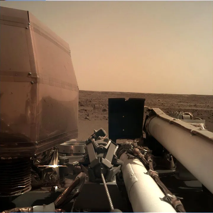  The landing data and initial photograph were relayed to Earth from two briefcase-sized satellites that were launched along with InSight Photograph:(X) 