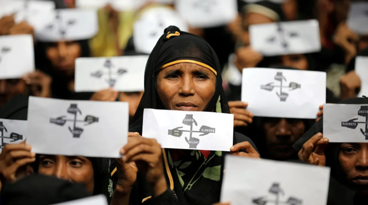  Rohingya refugee women hold placards as they take part in a protest at the Kutupalong refugee camp to mark the one-year anniversary of their exodus in Cox's Bazar, Bangladesh, August 25, 2018.  Photograph:(Reuters) 