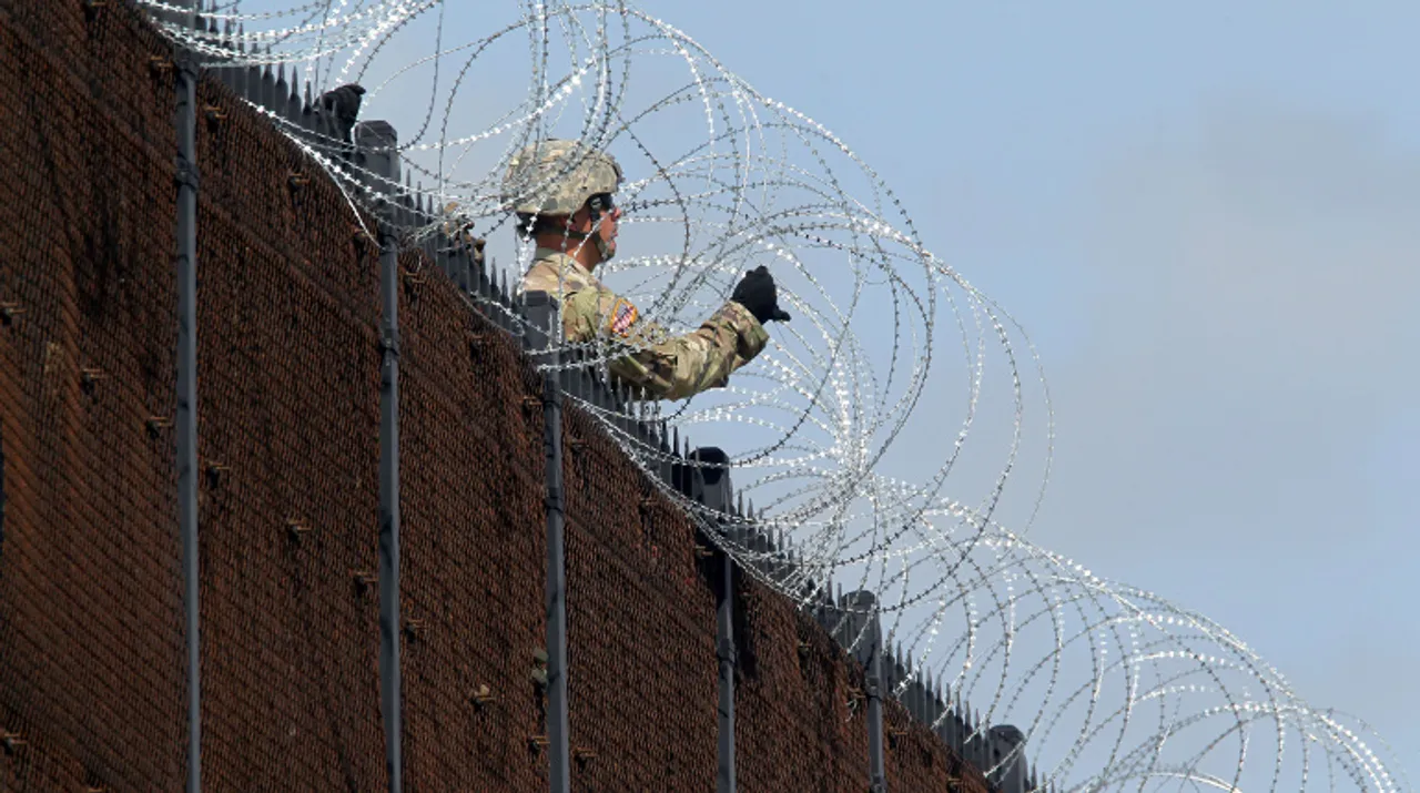  US Army soldiers install a barbed wire fence along Anzalduas International Bridge near the US- Mexico border in McAllen, Texas, November 5, 2018. Photograph:(Reuters) 