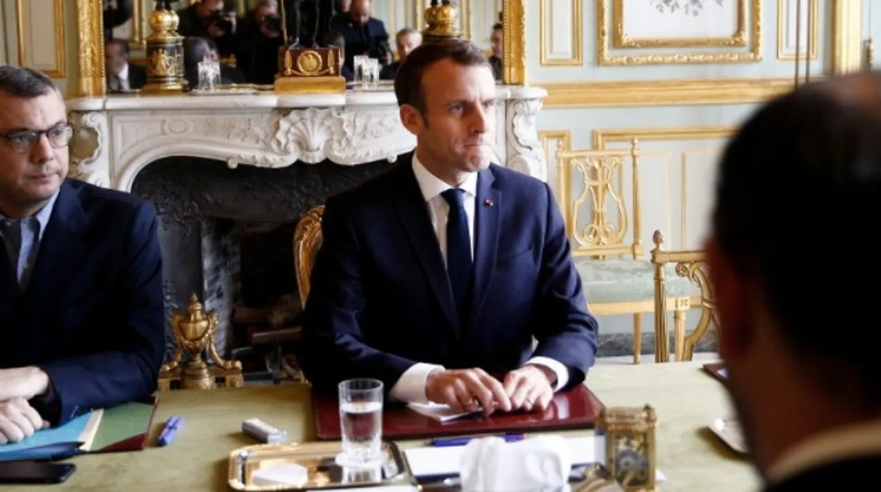  French President Emmanuel Macron (C) attends a meeting at the Elysee Palace in Paris. Photograph:(AFP) 