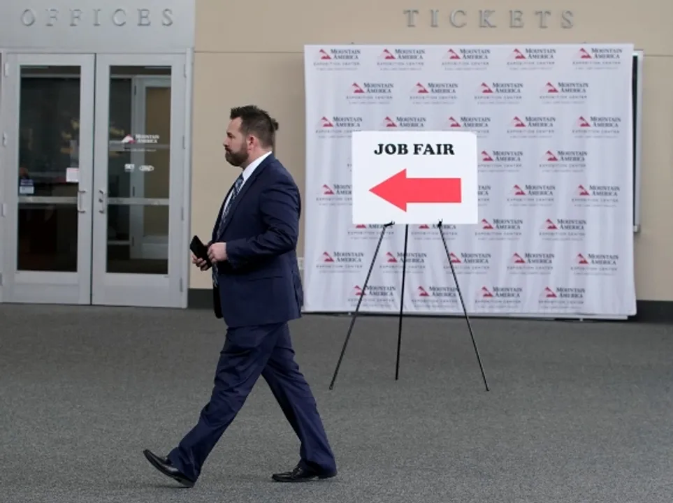  A man walks into register at a job fair at Sandy, Utah. Photograph:(Reuters) 