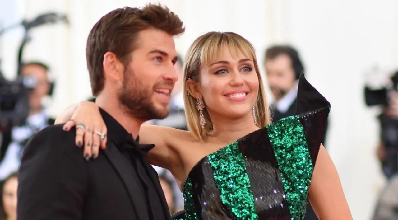  Miley Cyrus, Liam Hemsworth Photograph:(AFP) 