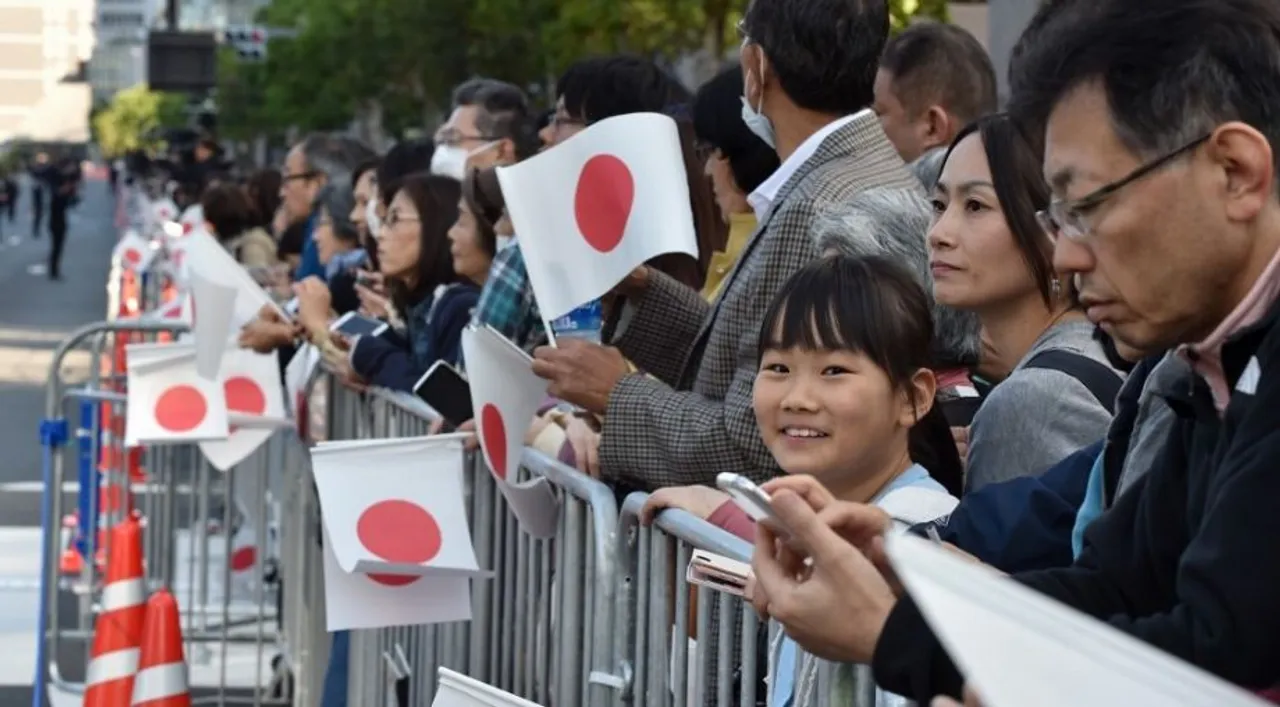  People holding Japan flags (file photo) Photograph:(AFP) 