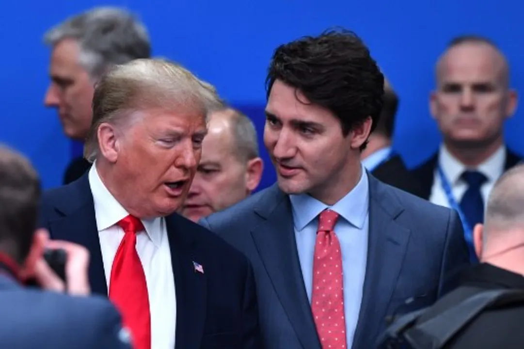  US President Donald TrumpÂ talks with Canada's Prime Minister Justin Trudeau during the plenary session of the NATO summit  Photograph:(AFP) 