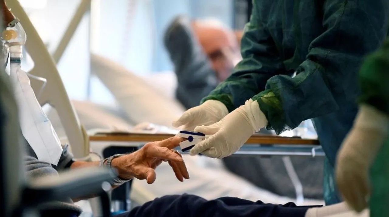  Medical staff in a protective suit treats a patient suffering from coronavirus disease (COVID-19) in an intensive care unit at the Oglio Po hospital in Cremona, Italy Photograph:(Reuters) 