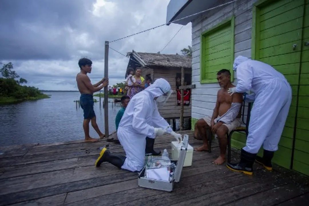  Health workers from the city of Melgaco check a resident of a small riverside community in the southwest of Marajo Island, state of Para, Brazil Photograph:(AFP) 