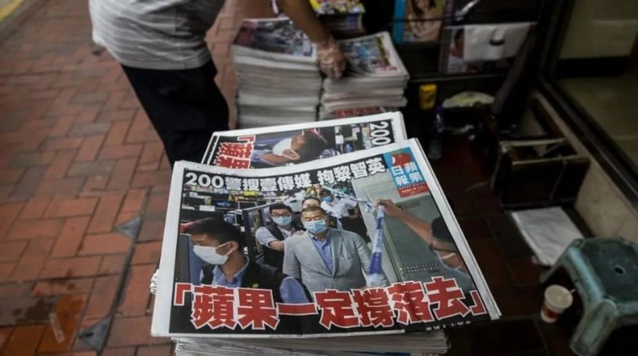  A newsstand sells copies of the Apple Daily newspaper (bottom) in Hong Kong on August 11, 2020, a day after authorities conducted a search of the newspaper's headquarters after the company's founder Jimmy Lai was arrested under the new national security law.  Photograph:(AFP) 
