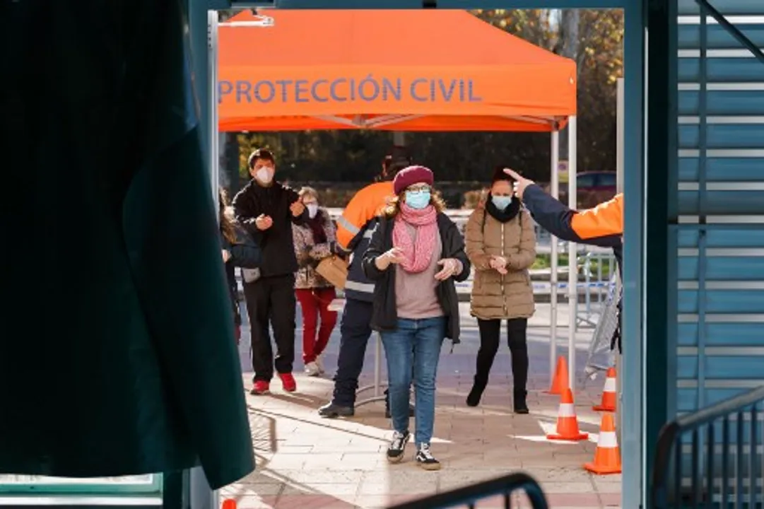  esidents queue to undergo antigen rapid tests for coronavirus during a mass screening to test 25 percent of the population in Burgos, northern Spain Photograph:(AFP) 