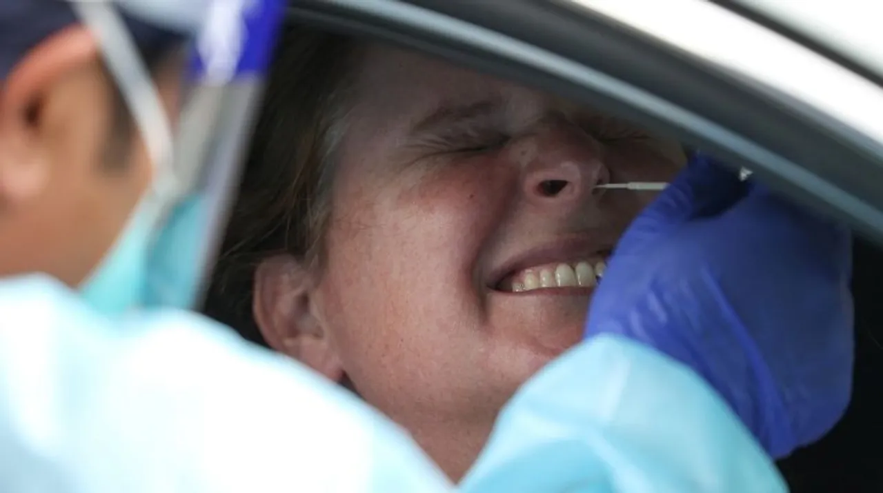  A person is swabbed by a medical professional at a drive-through coronavirus disease (COVID-19) testing clinic in the Warriewood suburb of Sydney, Australia, December 18, 2020 Photograph:(Reuters) 