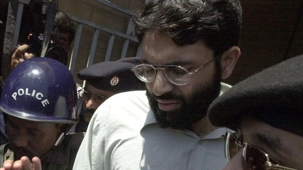  Ahmed Omar Saeed Sheikh seen here surrounded by Pakistani police in 2002 Photograph:(AFP) 