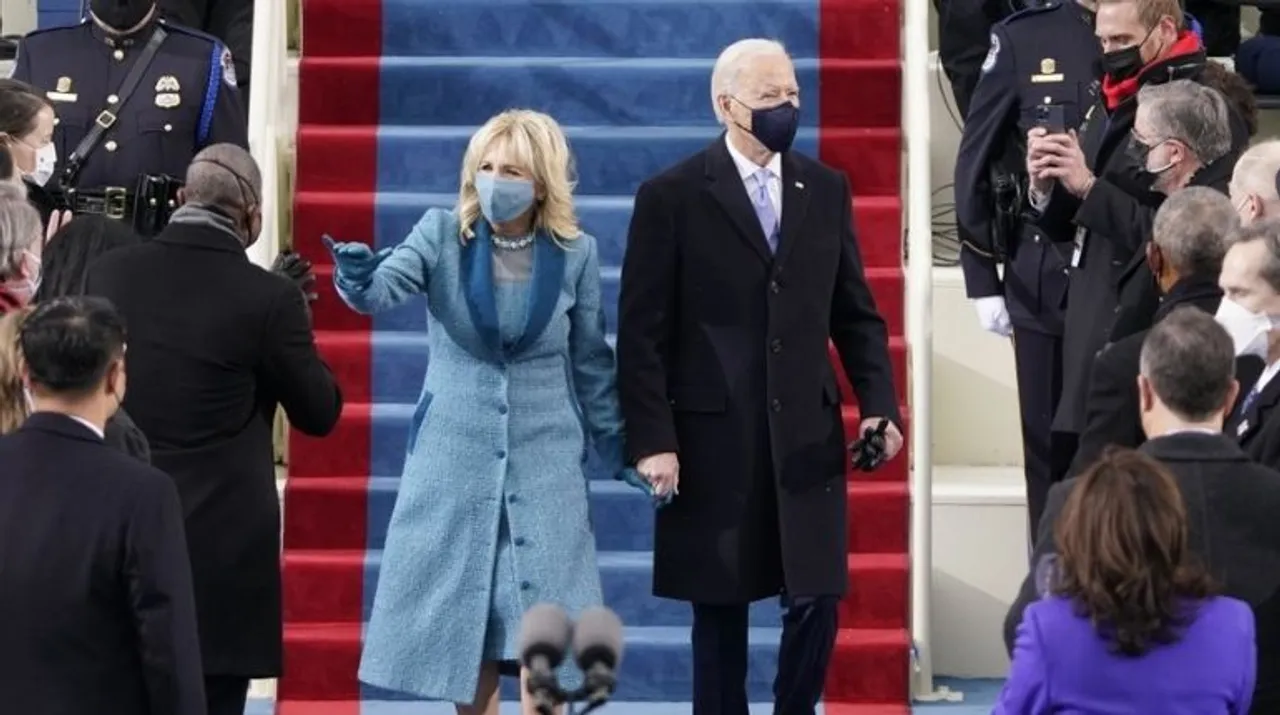  US President-elect Joe Biden flanked by wife Dr. Jill Biden arriving for his inauguration as the 46th US President on January 20, 2021, at the US Capitol in Washington, DC. Photograph:(AFP) 