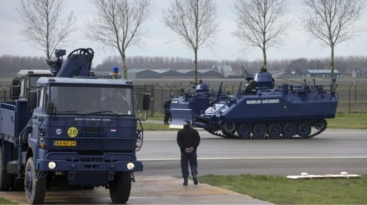 Dutch military police vehicles stand guard at Schiphol airport in Amsterdam Photograph:(AFP) 