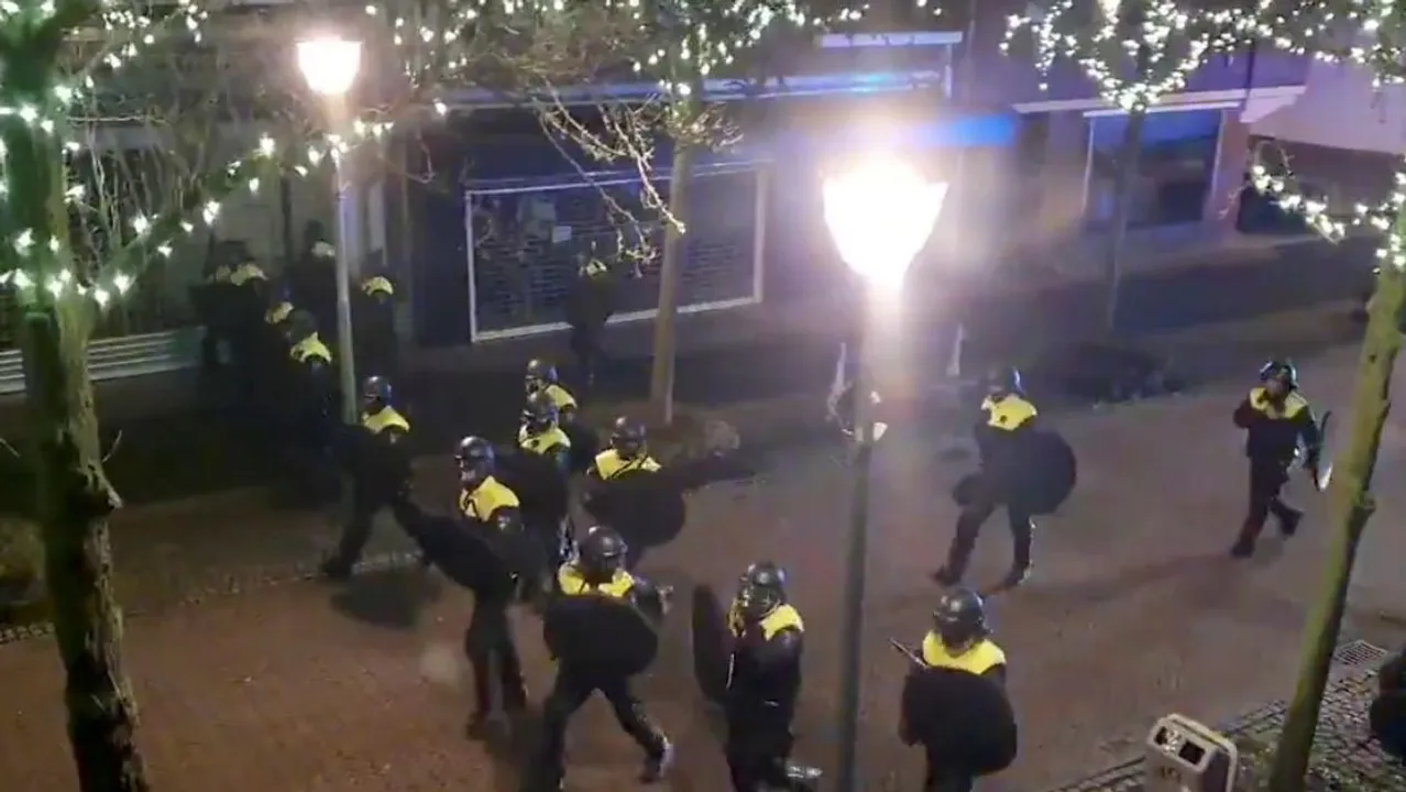  Police officers and vehicles arrive to disperse people from the site of one of the coronavirus disease (COVID-19) curfew protests in Geleen, Netherlands January 25, 2021, in this still image from video obtained from social media Photograph:(Reuters) 