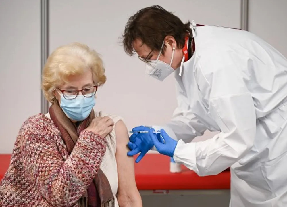  Doctor Renate BraunÂ vaccines Gerda Mueller, 86, against COVID-19 at a vaccination centre in Heuchelheim, western Germany Photograph:(AFP) 