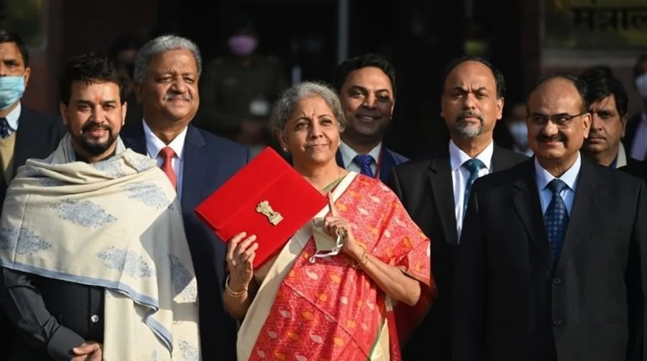  India's Finance Minister Nirmala Sitharaman (C) along with her staff leaves the Finance Ministry to present the annual budget in parliament in New Delhi Photograph:(AFP) 