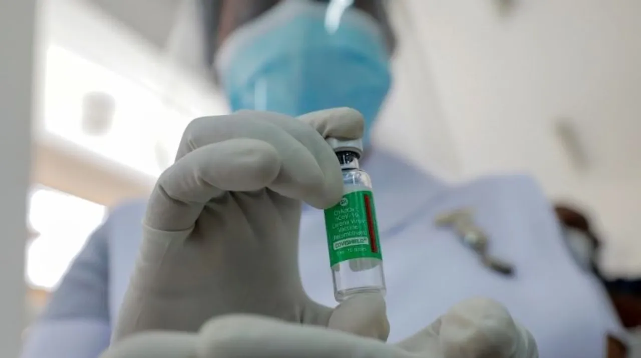  A Health official shows a bottle with a dose of the AstraZeneca's COVID-19 vaccine manufactured by the Serum Institute of India Photograph:(Reuters) 
