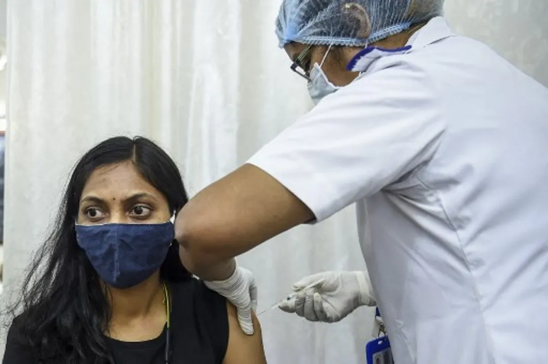  A medical staff inoculates a colleague with a Covid-19 coronavirus vaccine at the Nair Hospital's vaccination centre in Mumbai Photograph:(AFP) 