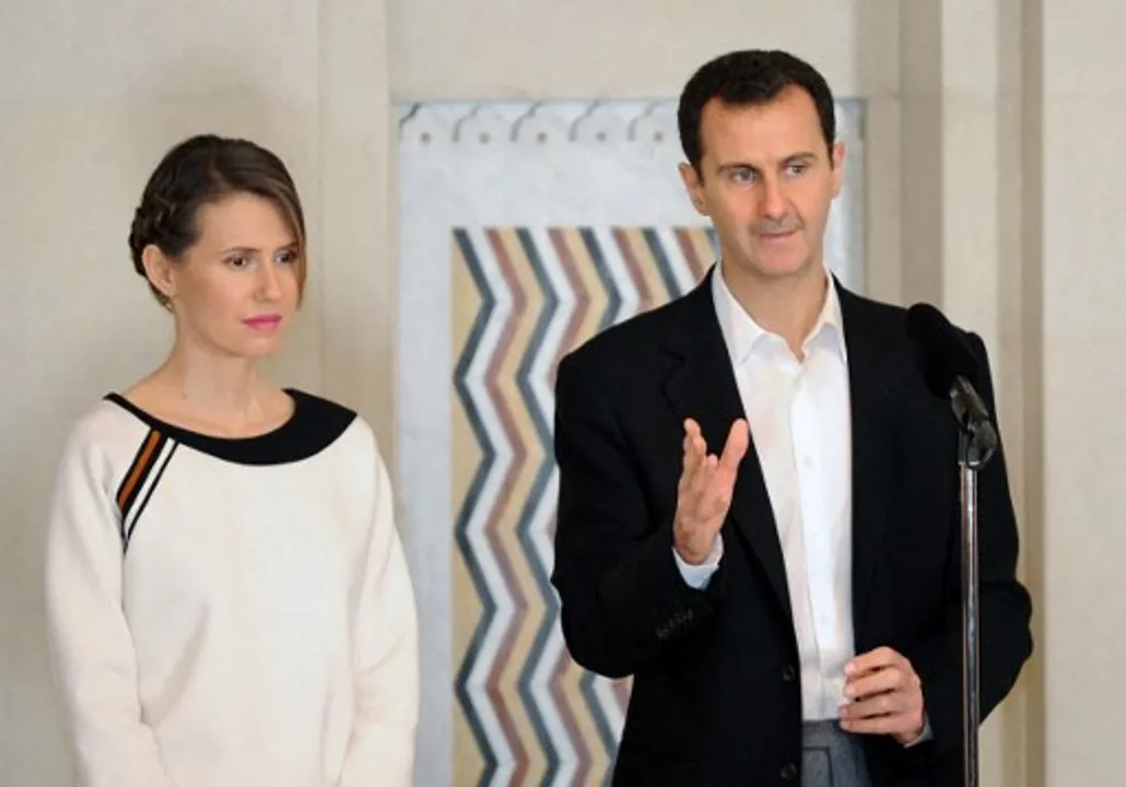  Syrian President Bashar al-Assad with his wifeÂ Asma al-Assad Photograph:(AFP) 