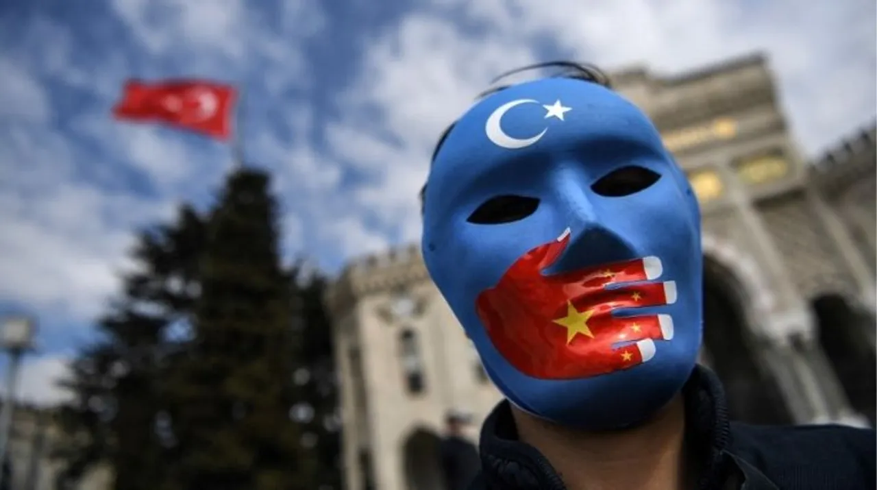  A demonstrator wearing a mask painted with the colours of the flag of East Turkestan takes part in a protest by supporters of the Uighur minority on April 1, 2021 at beyazid square in Istanbul. Photograph:(AFP) 