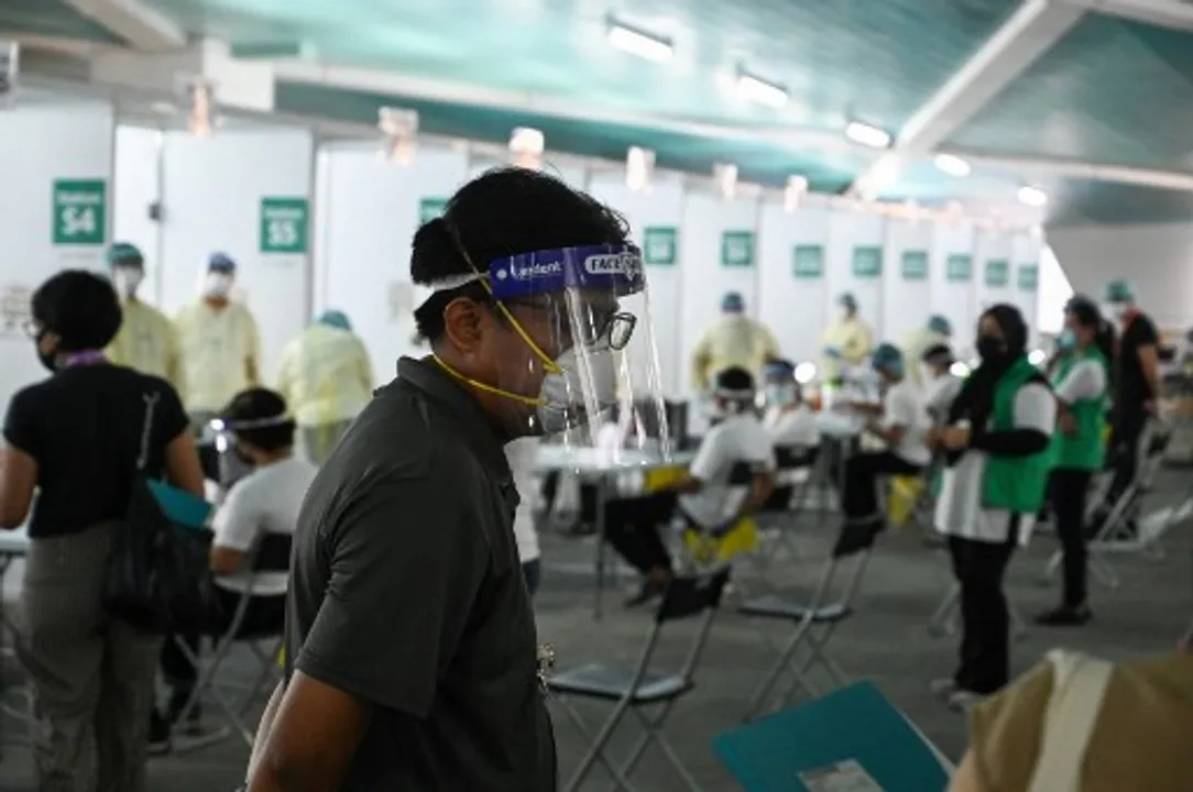  Health personnel prepare antigen rapid test for Covid-19 coronavirus for passengers during embarkation procedures on World Dream cruise ship for "cruises to nowhere" at Marina Bay Cruise Centre in Singapore Photograph:(AFP) 