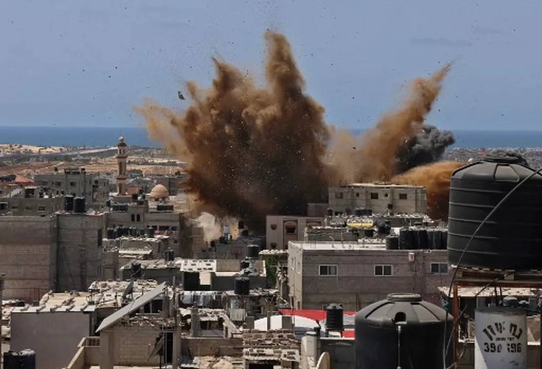  A targeted building is hit during an Israeli airstrike in Rafah in Gaza Strip on May 20 Photograph:(AFP) 