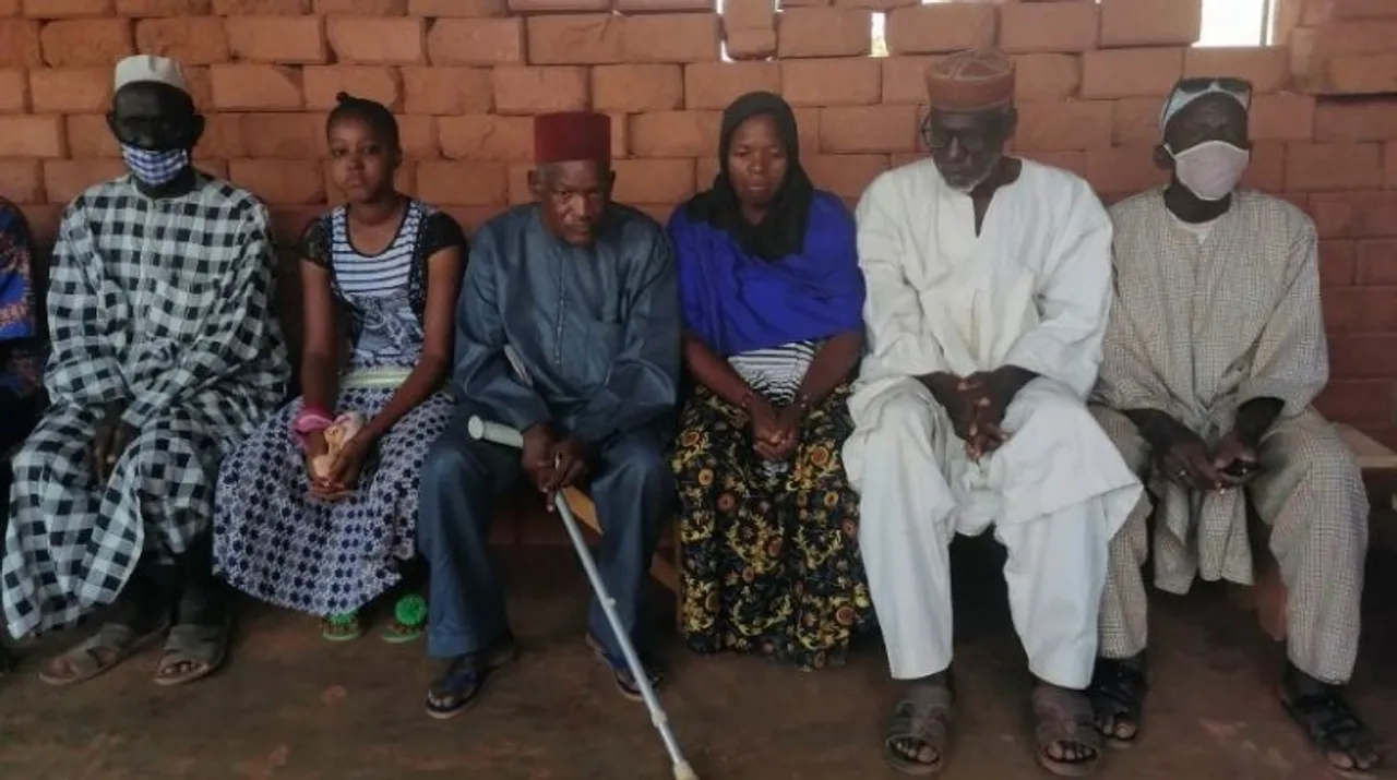  Emir Djibril Diallo, chief negotiator in the talks between the jihadists and the Thiou population is pictured with the displaced peoples of Koumbri during a visit at the displaced camp of Ouahigouya, Burkina Faso Photograph:(Reuters) 