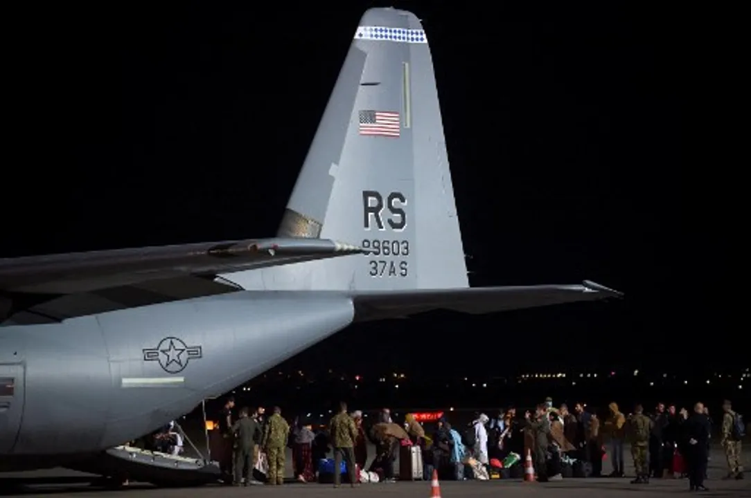  Afghan refugees exit aÂ US Air Force plane upon their arrival at Pristina International airport inÂ Kosovo Photograph:(AFP) 