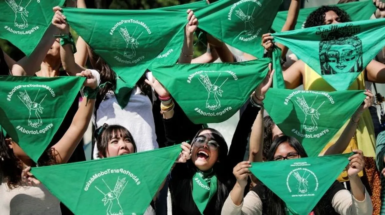 Women hold green handkerchiefs during a protest in support of legal and safe abortion in Mexico City, Mexico Photograph:(Reuters) 