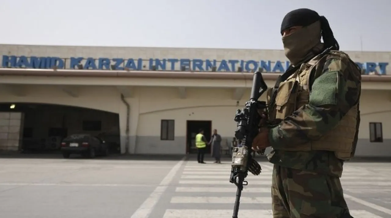  A Taliban fighter stands guard on the tarmac at the airport in Kabul on Saturday. Photograph:(AFP) 