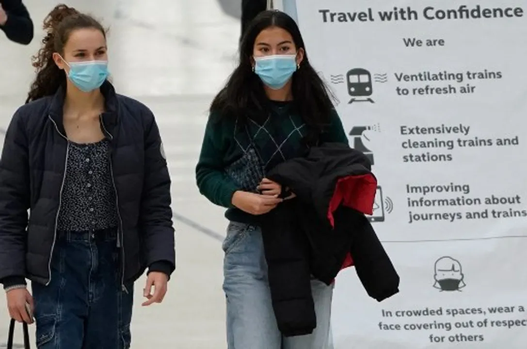  CommutersÂ walk through Waterloo train station in central LondonÂ  Photograph:(AFP) 