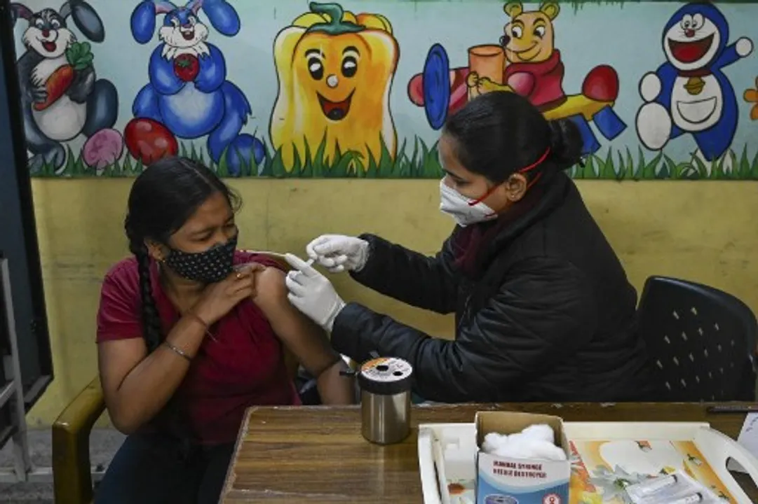  A health worker inoculates a girl at a vaccination camp in New Delhi  Photograph:(AFP) 