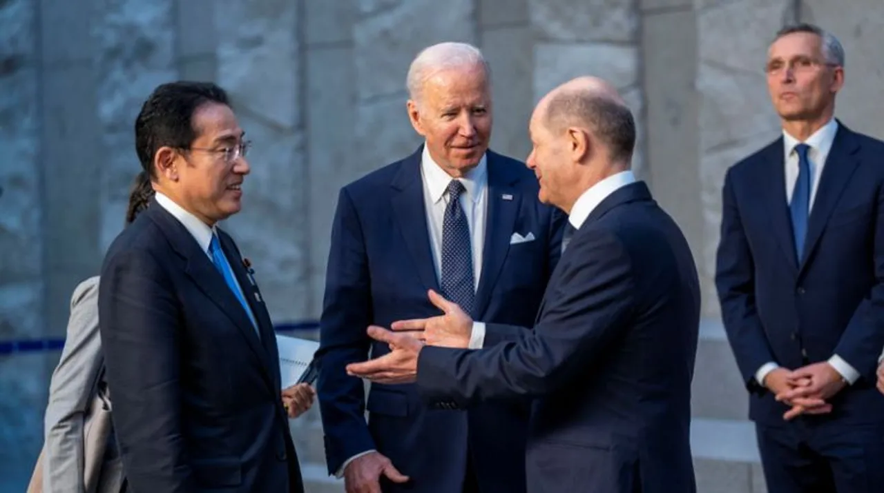  US President Joe Biden talks with German Chancellor Olaf Scholz and Japanese Prime Minister Fumio Kishida during a family photo with G7 leaders at NATO Headquarters in Brussels, Belgium. Photograph:(Reuters) 