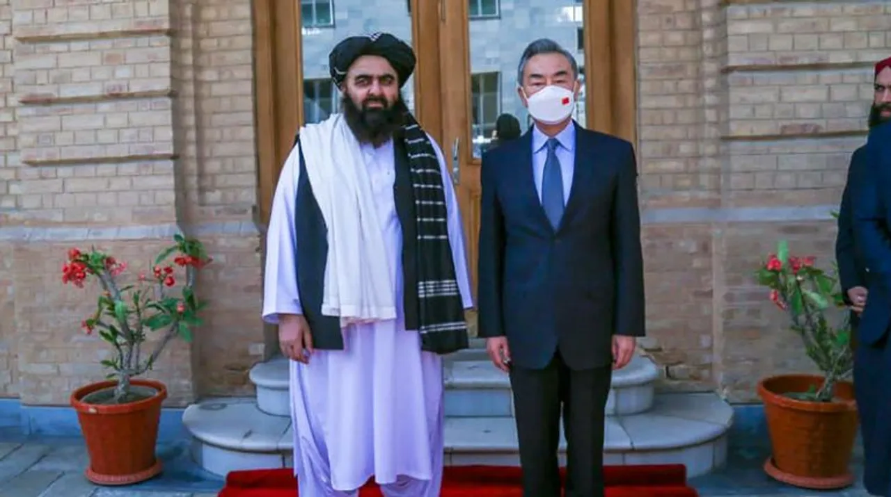  Taliban Foreign Minister Amir Khan Muttaqi (L) posing with China's Foreign Minister Wang Yi (R) in Kabul. Photograph:(AFP) 