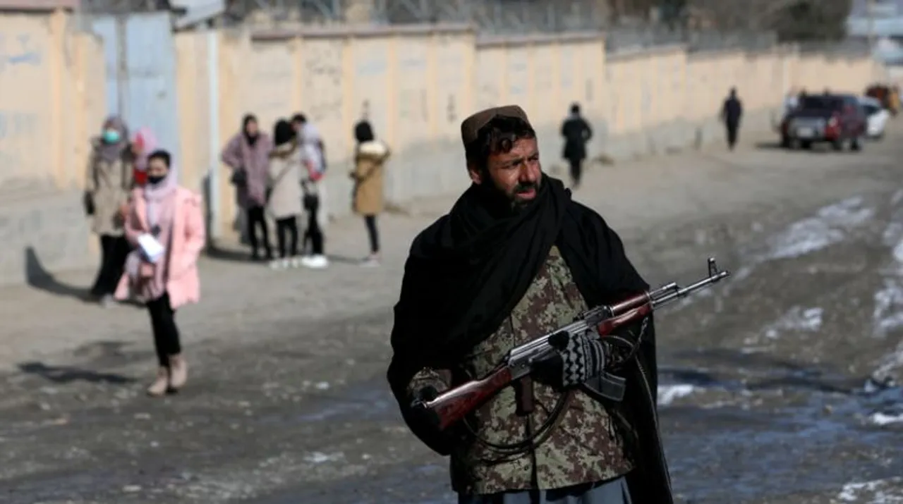   A Taliban fighter guards a street in Kabul, Afghanistan. Photograph:(Reuters) 