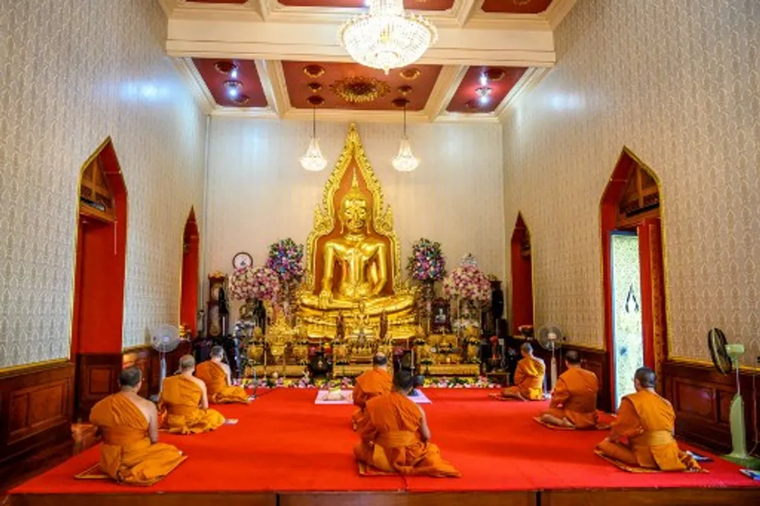  Thai Buddhist monks prepare to take part in a televised anti-plague prayer at Wat Traimit Temple  Photograph:(AFP) 