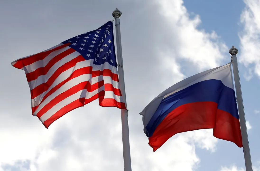  Russian and US state flags fly near a factory in Vsevolozhsk Photograph:(Reuters) 