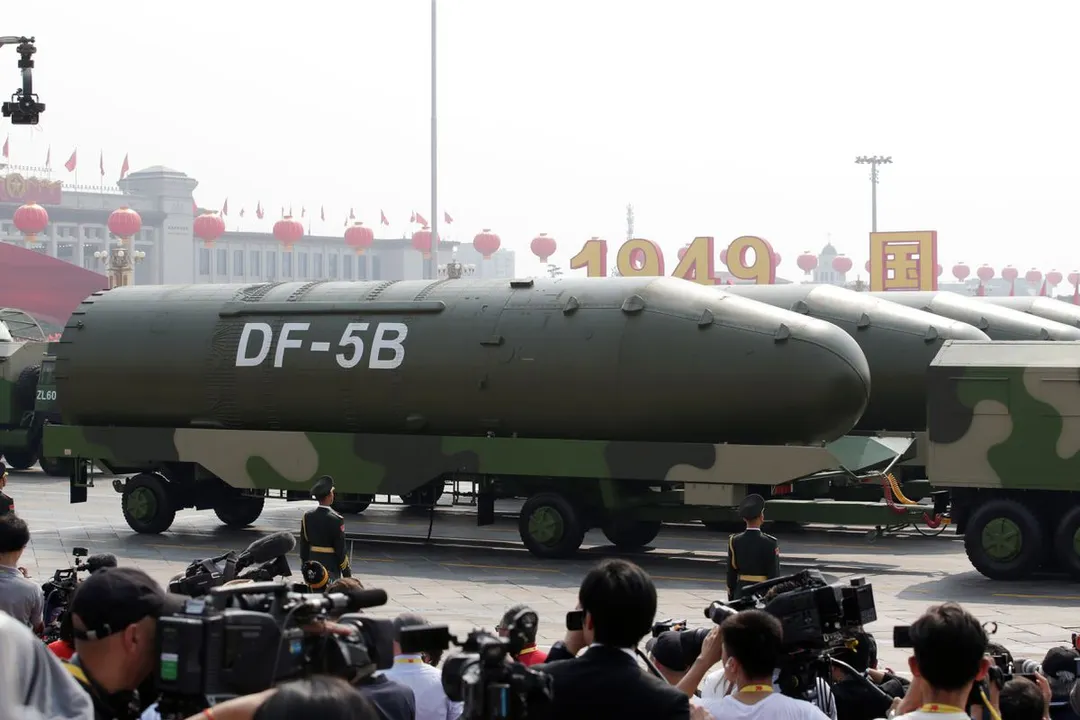  Military vehicles carrying DF-5B intercontinental ballistic missiles travel past Tiananmen Square Photograph:(Reuters) 