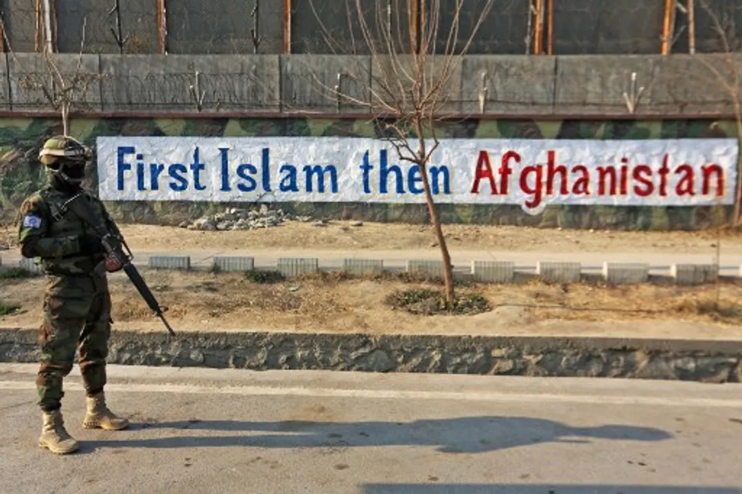  A Taliban fighter stands guard along a street in Kabul.  Photograph:(AFP) 