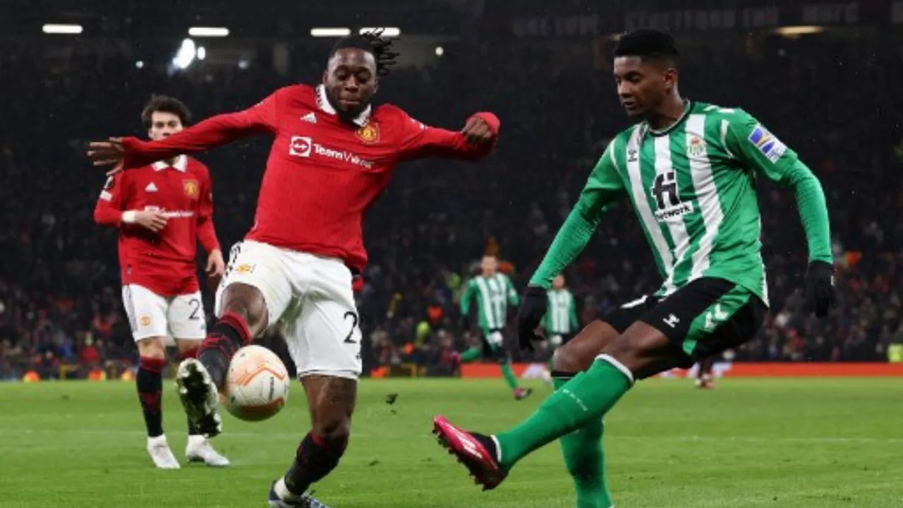  Manchester United's Aaron Wan-Bissaka vies with Real Betis' Abner Vinicius. Photograph:(AFP) 