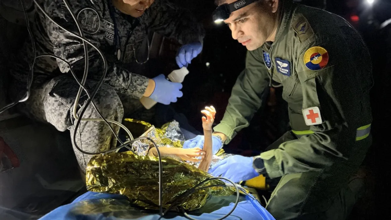  Members of the Colombian Army checking one of the four Indigenous children. Photograph:(AFP) 