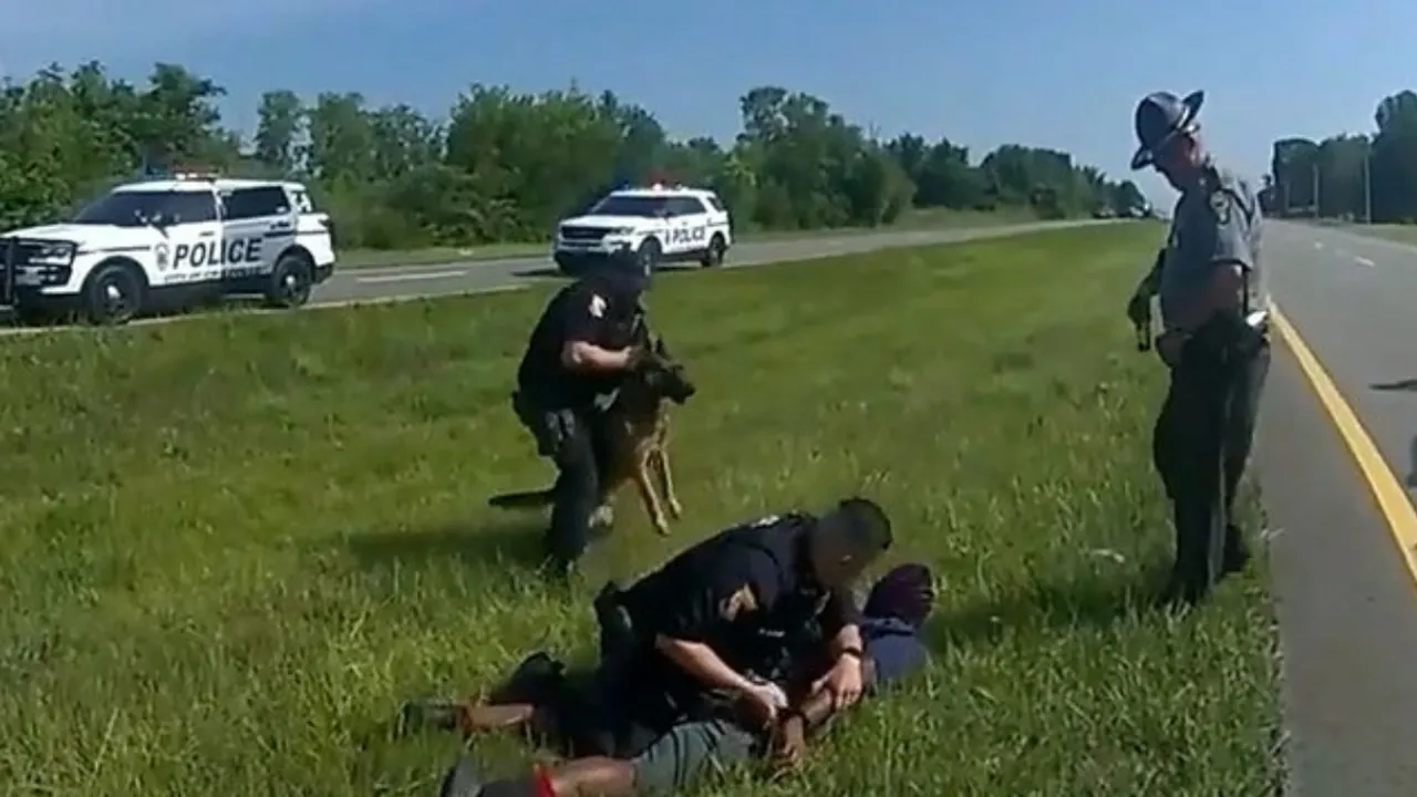  A snapshot of the video in which the dog attacked the Black man. Photograph:(Reuters) 