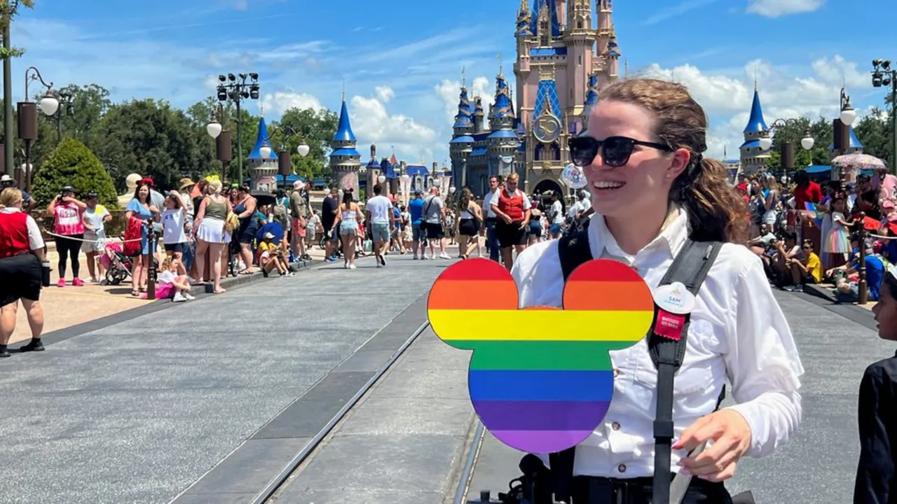  A Walt Disney World photographer holds a Pride rainbow-coloured Mickey Mouse cutout before the "Festival of Fantasy" parade at the Walt Disney World Magic Kingdom theme park in Orlando, Florida. Photograph:(Reuters) 