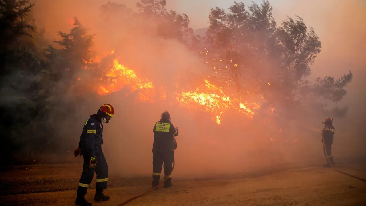  Firefighters try to extinguish a wildfire burning in Ntrafi, Athens, Greece Photograph:(Reuters) 