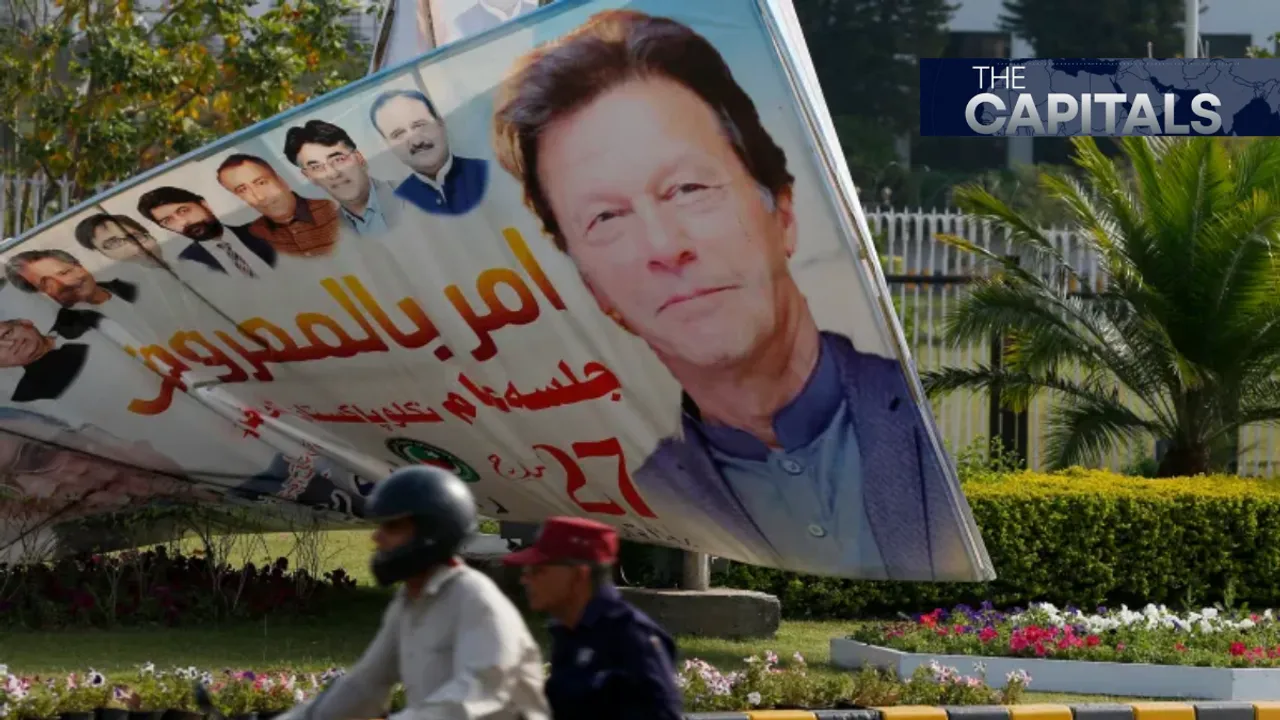  A motorcyclist rides past a billboard with the picture of former Pakistan PM Imran Khan Photograph:(Agencies) 