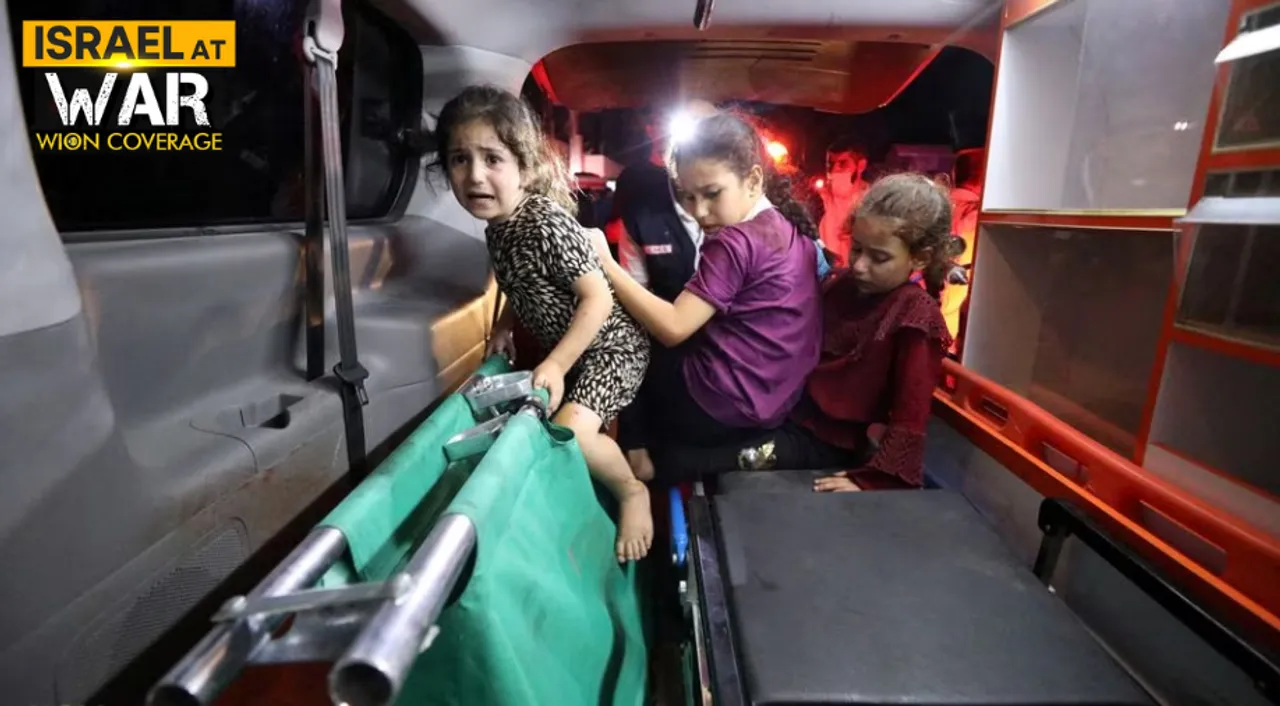  Children sit in the back of an ambulance at Shifa Hospital Photograph:(Reuters) 